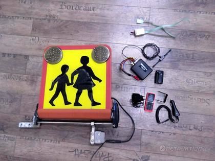 Skolskylt, mobiltelefon och personsökare